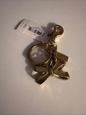 Coach bow charm
